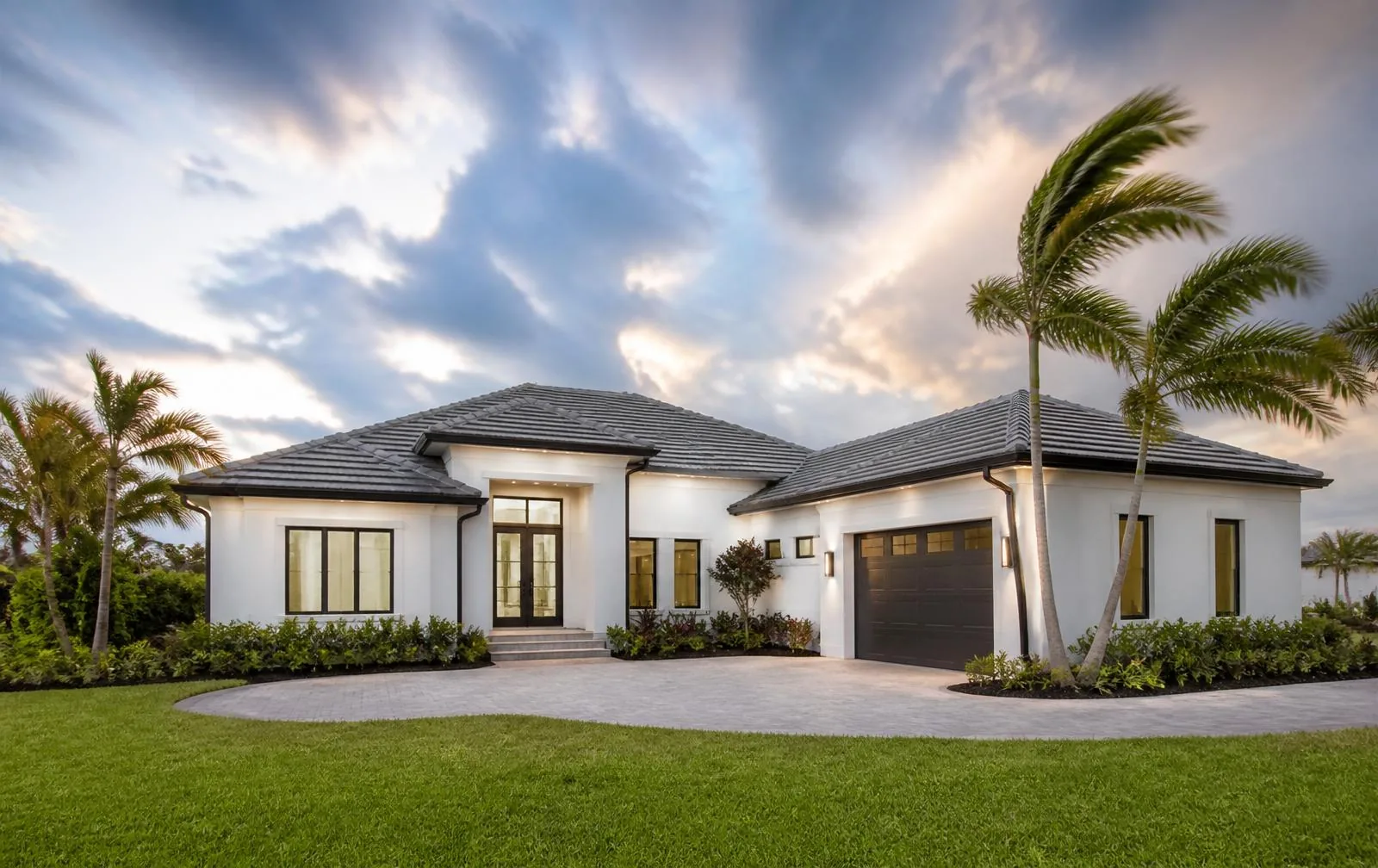 Well-maintained South Florida home exterior with new roof and landscaping