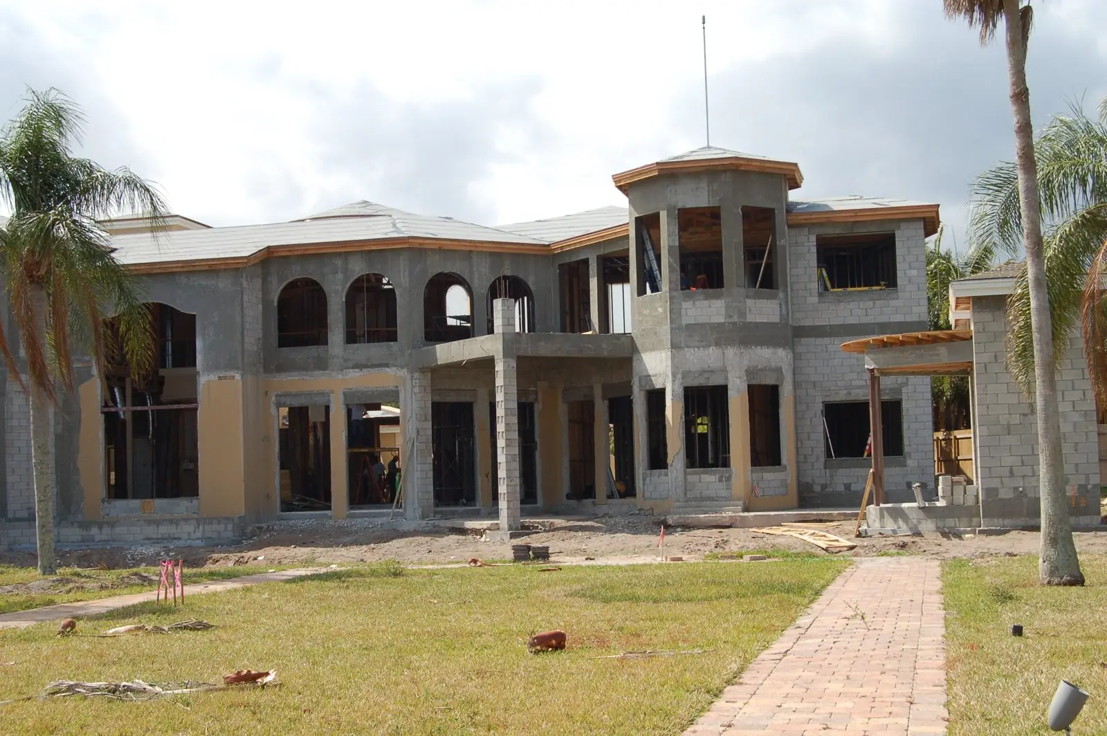 Custom home under construction in South Florida with CMU block walls and second-story shell