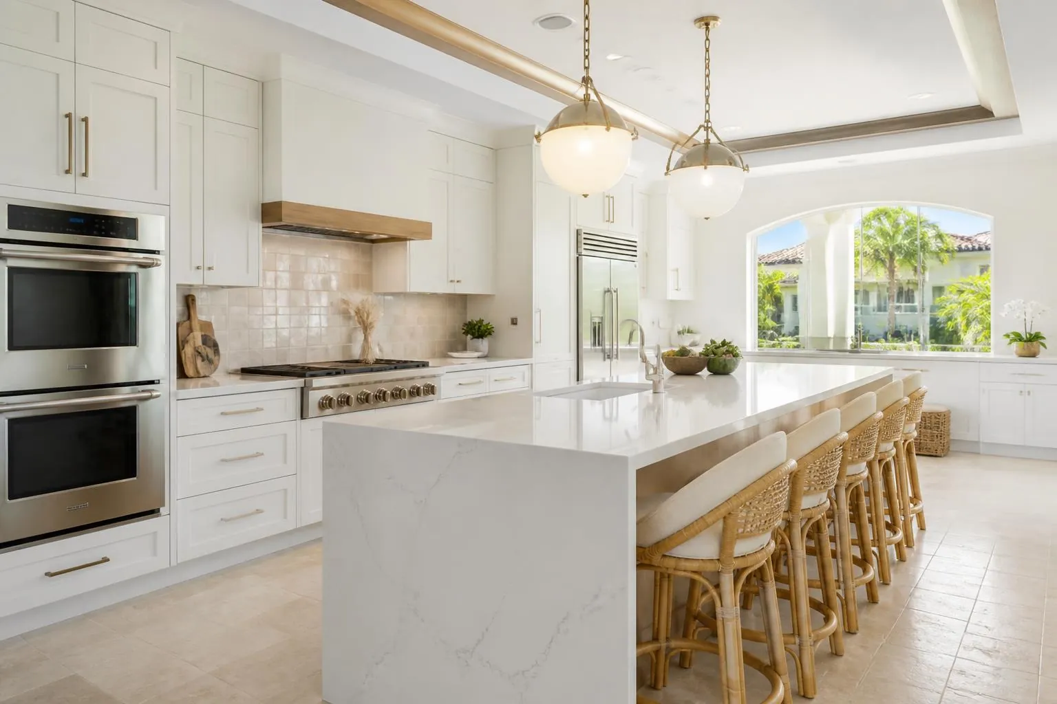 Completed luxury Boca Raton kitchen with white oak cabinetry, quartzite island, and palm views