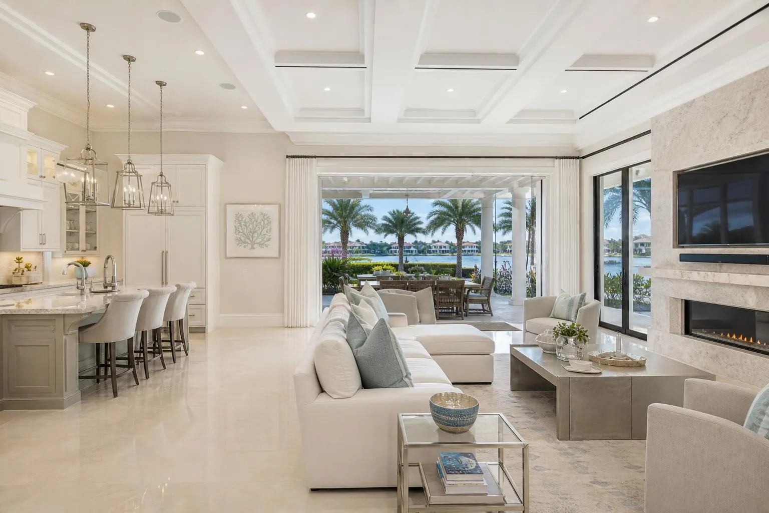 Finished luxury Boca Raton living room and kitchen interior with waterfront palm views